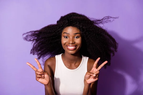 Portrait of charming dark skin person two arms fingers show v-sign isolated on purple color background — Stok Foto