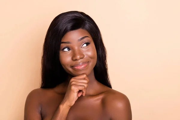 Portrait of attractive cheery curious girl thinking copy space health care solution isolated over beige pastel color background — Stock Photo, Image