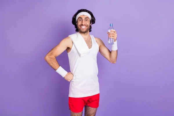 Photo of optimistic brunette guy drink water wear spectacles white hair band singlet isolated on lilac color background — Stock Photo, Image