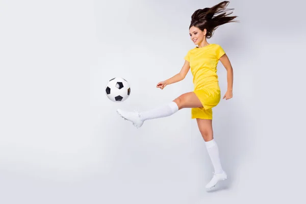 Full length body size view of nice attractive strong energetic motivated cheerful straight-haired girl playing game having fun hitting ball isolated over light white gray pastel color background — Zdjęcie stockowe