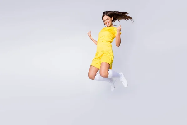 Full length body size view of nice beautiful pretty energetic glad overjoyed cheerful straight-haired girl jumping having fun isolated over light white gray pastel color background — Stock fotografie