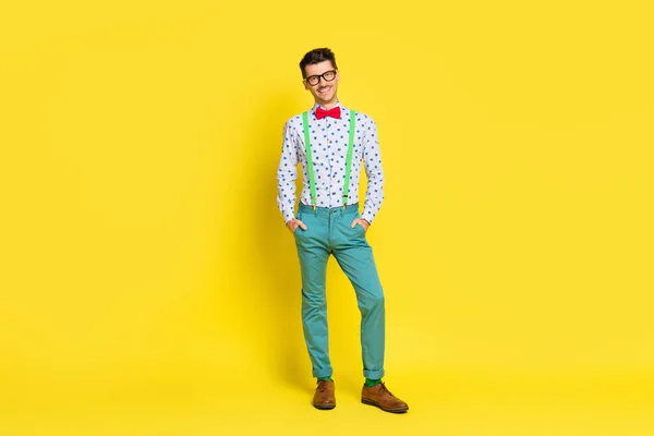 Full length body size view of attractive cheerful skinny guy wearing festal look isolated over bright yellow color background — Stock Photo, Image