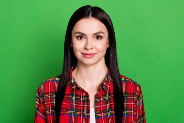 Portrait of attractive cheery content brunet girl wearing checked shirt isolated over vibrant green color background — Stock Photo, Image