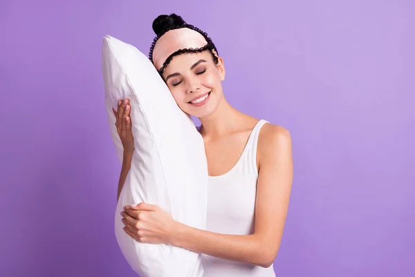 Photo of happy smiling cheerful good mood girl hug embrace pillow daydreaming relaxing isolated on violet color background — Stock Photo, Image