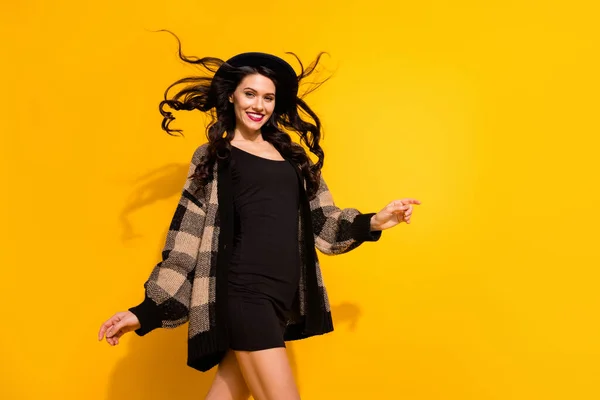 Photo of attractive happy young woman walk weekend rest smile copyspace isolated on yellow color background — Stock Photo, Image