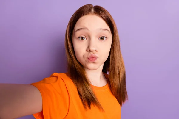 Self-portrait of beautiful trendy funky girl sending air kiss good mood isolated over violet purple color background — Stock Photo, Image