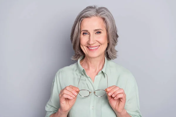 Photo of happy cheerful smiling positive mature woman after stomatology treatment isolated on grey color background — Stock Photo, Image