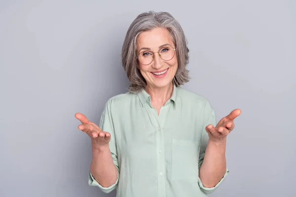 Photo of happy excited positive good mood mature woman talking communicating isolated on grey color background — Stock Photo, Image