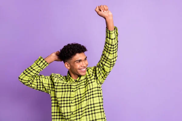 Photo portrait of guy curious happy dancing at party looking empty space isolated on pastel purple color background — Stock Photo, Image