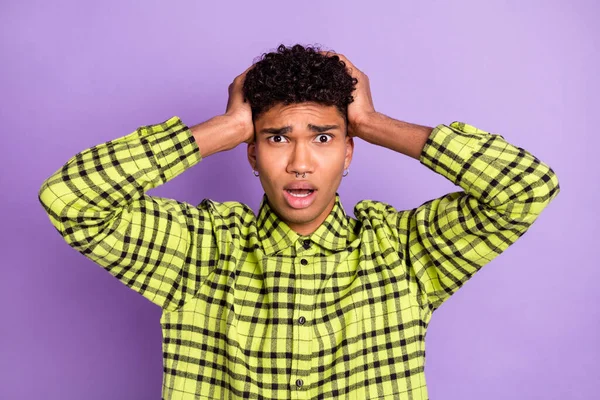 Portrait of attractive worried miserable guy bad news reaction isolated over violet purple color background — Stock Photo, Image