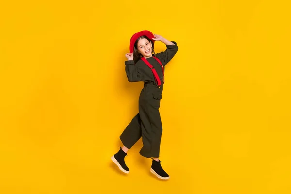 Full length body size view of lovely glad cheerful girl posing walking good mood isolated over bright yellow color background — Stock Photo, Image