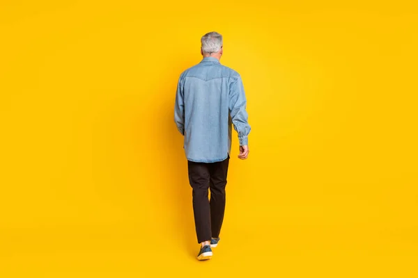 Full length back photo of trend grandpa go wear jacket pants shoes isolated on yellow color background — Stockfoto