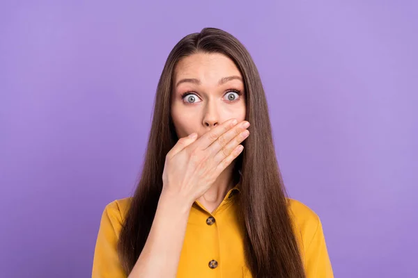 Photo of stressed young lady close lips wear yellow shirt isolated on vivid violet color background — 스톡 사진