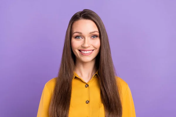 Photo of optimistic millennial lady wear yellow shirt isolated on violet color background — Stockfoto