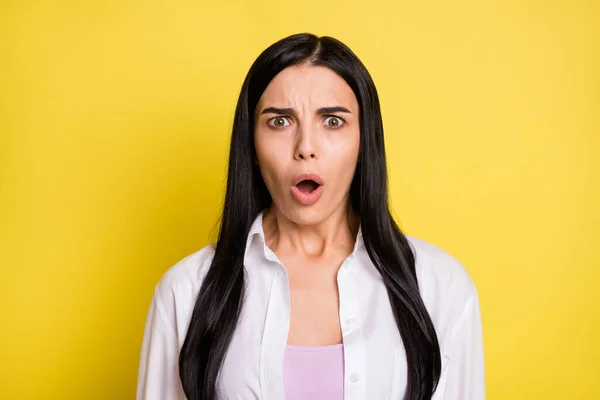 Photo of astonished shocked attractive young woman open mouth fake news isolated on yellow color background — Stock Photo, Image