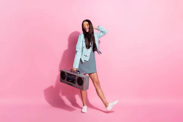 Full length photo of adorable sweet young girl dressed blue jacket dancing holding boom box isolated pink color background — Stock Photo, Image