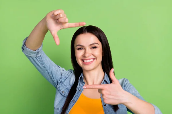 Photo of funky cute brown hairdo lady make photo wear jeans shirt isolated on green background — Stock Photo, Image