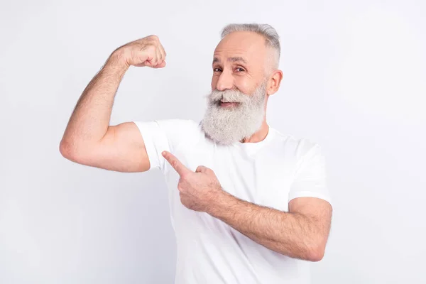 Photo of happy positive old man power show biceps point finger recommend isolated on grey color background — Foto de Stock
