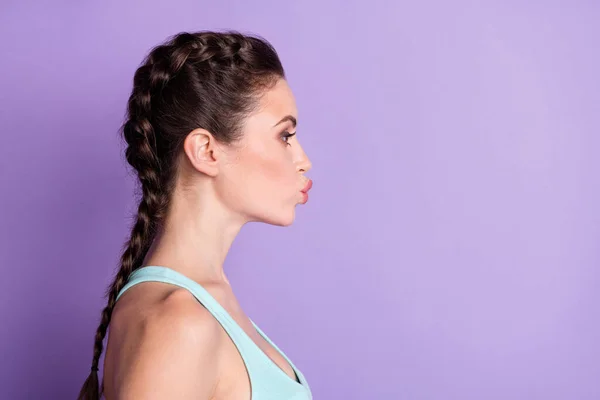 Profile side view portrait of attractive amorous girl sending air kiss copy space isolated over violet purple color background — 스톡 사진