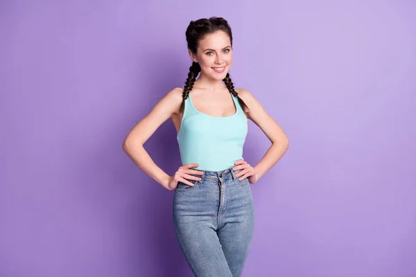 Portrait of winsome cheerful content girl posing hands on hips wearing tanktop isolated over violet purple color background — 스톡 사진