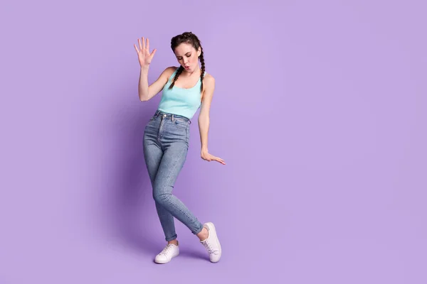 Full body photo of funky joyful young woman dance wear casual outfit isolated on purple violet color background — Stock Photo, Image