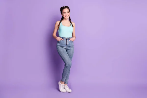 Full length photo of nice brown hair lady look empty space wear blue top isolated on purple color background — Stok fotoğraf