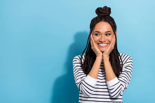 Photo portrait of girl with dreadlocks smiling touching cheekbones looking blank space isolated pastel blue color background — ストック写真