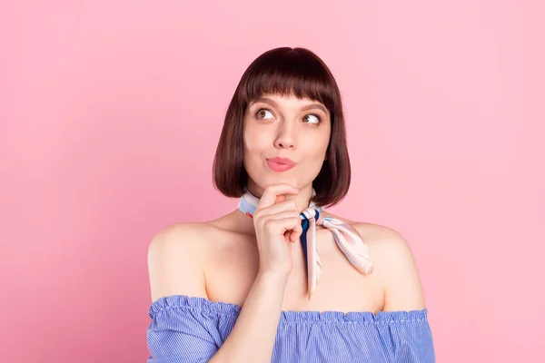 Photo dreamy minded young woman hold finger chin think imagine isolated on pastel pink color background — Foto Stock