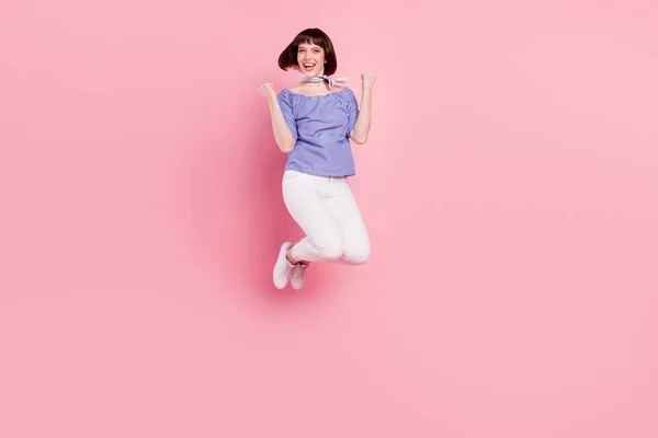 Full length body size photo woman jumping up gesturing like winner isolated pastel pink color background — Photo
