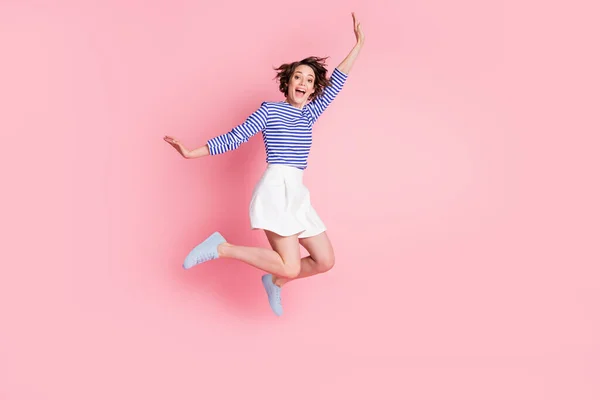 Full size photo of young beautiful crazy happy excited crazy cheerful girl jump in victory isolated on pink color background — ストック写真