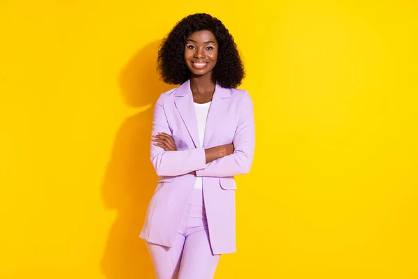 Photo of young happy cheerful lovely african businesswoman with crossed hands isolated on yellow color background — Stock Photo, Image