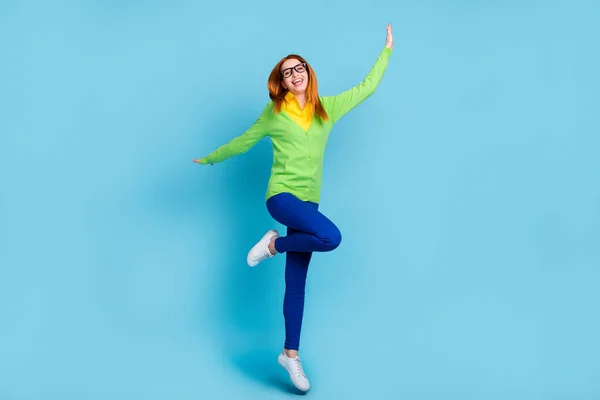 Full length body size view of attractive cheerful girl jumping dancing isolated over bright blue color background — ストック写真