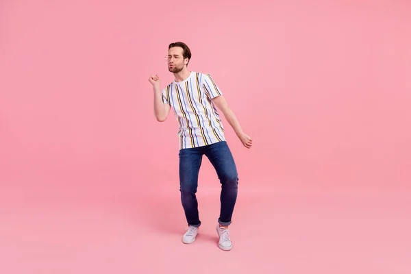 Full length body size photo man in casual clothes dancing at party isolated pastel pink color background — Zdjęcie stockowe