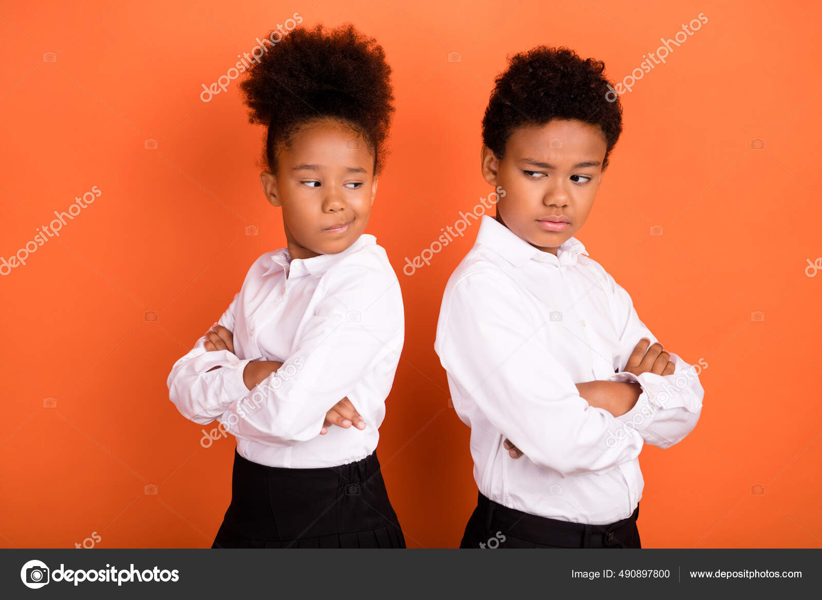 Profile side photo of two young black kids folded hands unhappy offended  conflict isolated over orange color background Stock Photo by ©deagreez1  490897800