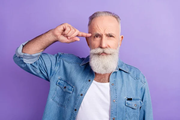 Photo of bully teasing mature man dressed denim outfit finger temple isolated purple color background — Photo