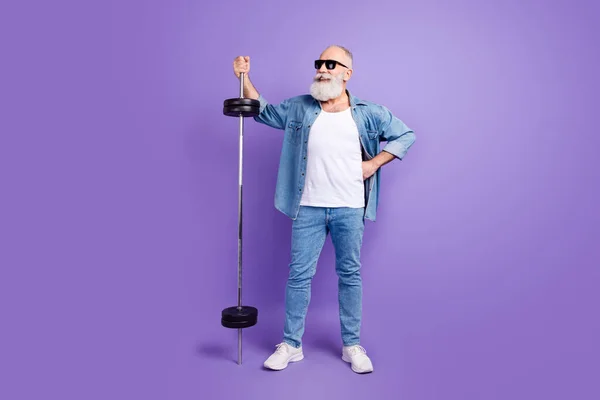 Full length photo of aged sportive man happy positive smile barbell muscles training isolated over violet color background — Photo