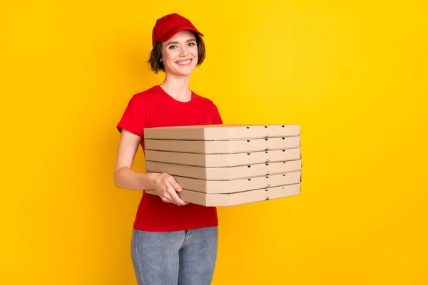 Photo of nice optimistic brown hair lady hold pizza wear t-shirt cap isolated on yellow background — Stok fotoğraf