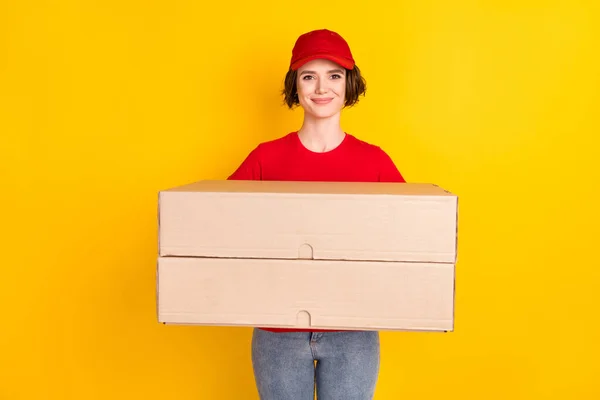 Photo portrait of female worker keeping two big boxes moving service isolated on vibrant yellow color background — Stok fotoğraf
