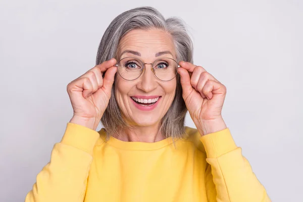 Portrait of mature good looking cheerful amazed woman in glasses see huge sale discount isolated on grey color background —  Fotos de Stock