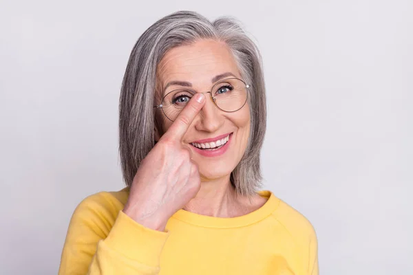 Portrait of happy cheerful beautiful grandmother point finger glasses recommend oculist isolated on grey color background —  Fotos de Stock