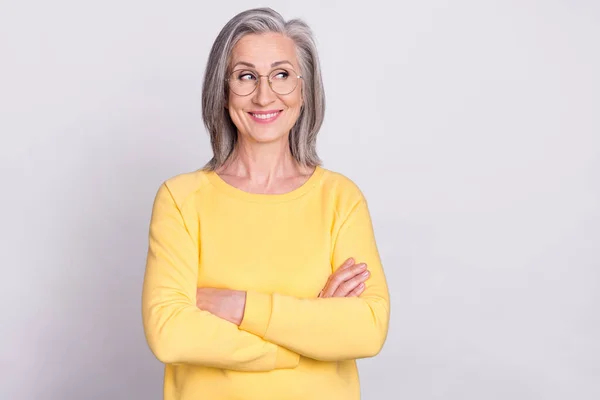 Photo of beautiful dreamy smiling confident businesswoman in glasses with folded arms isolated on grey color background — Foto Stock