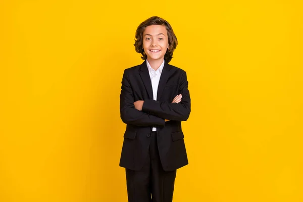 Photo of confident self-assured schoolboy toothy smile wear black uniform isolated yellow color background — Fotografia de Stock