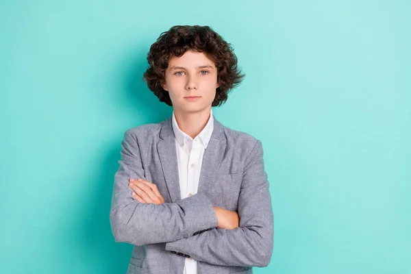 Photo of serious confident schoolboy dressed grey suit arms crossed isolated teal color background — Stockfoto