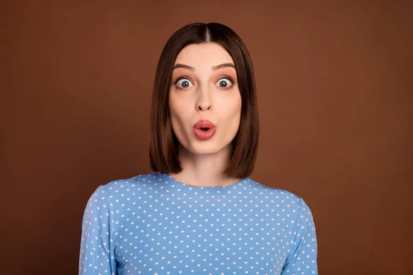 Photo of impressed brunette young lady look camera wear blue shirt isolated on brown color background — Stockfoto