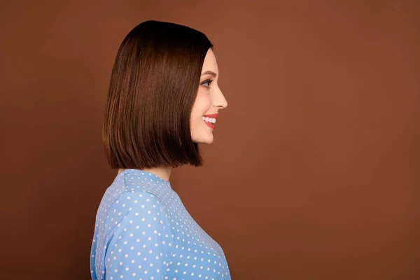 Profile photo of lovely bob hairdo young lady look empty space wear blue blouse isolated on brown color background — Fotografia de Stock