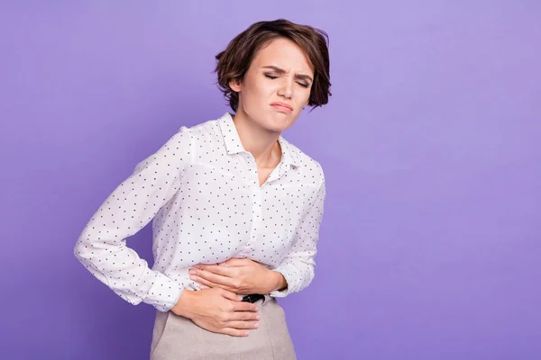 Photo of negative young person closed eyes hands on stomach bad mood isolated on violet color background — Stock Photo, Image