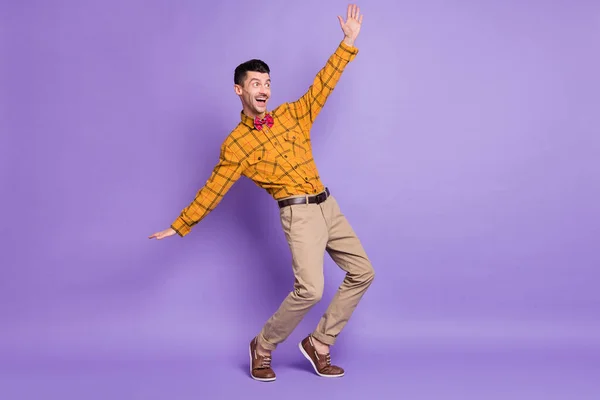 Full body photo of young excited carefree man happy positives mile have fun look empty space isolated over purple color background — Stock Photo, Image
