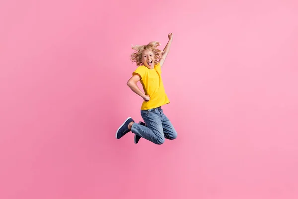 Full size profile side photo of young boy happy positive smile jump fly air superman isolated over pink color background — Stock Photo, Image