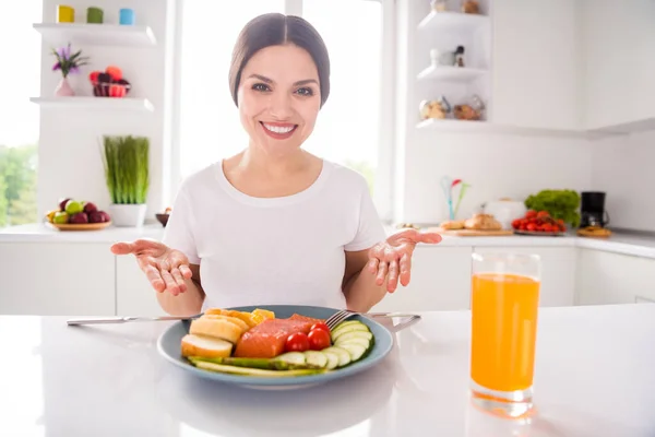 Photo of cheerful young attractive charming woman smile show hands meal dinner indoors inside home kitchen — Stock Photo, Image