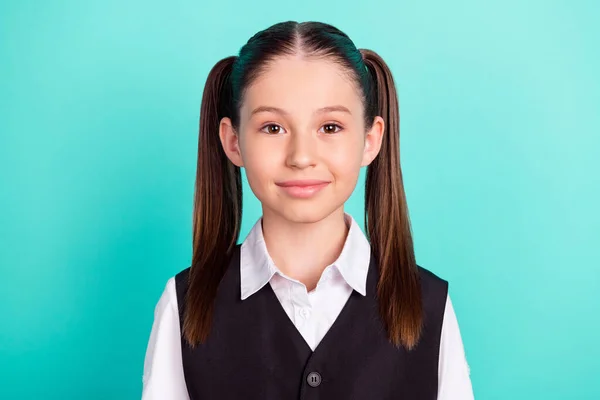 Foto retrato niña con colas sonriendo en uniforme aislado pastel verde azulado color de fondo —  Fotos de Stock